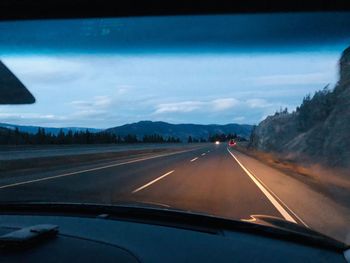 Road seen through car windshield