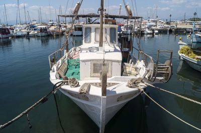 Fishing boats moored at harbor