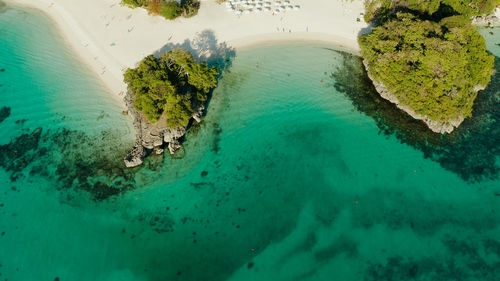 Tropical lagoon with turquoise water and white sand beach boracay, philippines. 