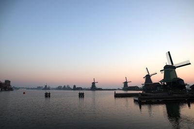 Commercial dock against clear sky during sunset