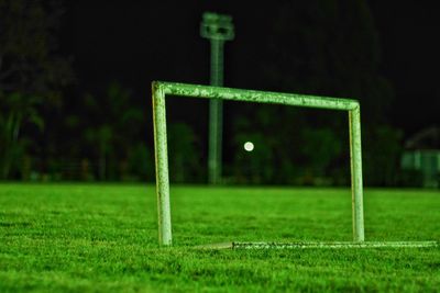 Close-up of soccer field against sky at night
