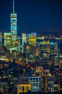 Aerial view of city lit up at night