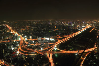 High angle view of illuminated city buildings at night