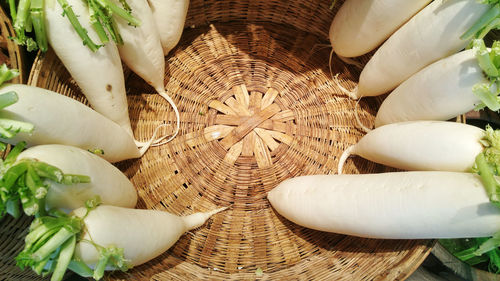 High angle view of white roses in basket