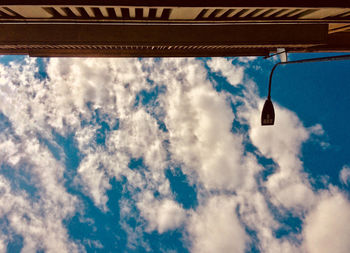 Low angle view of hanging roof against sky