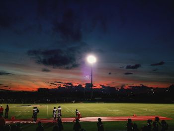 People at park against sky at sunset