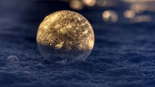 Close-up of crystal ball on rock