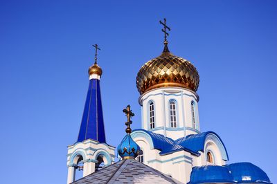 Low angle view of building against blue sky