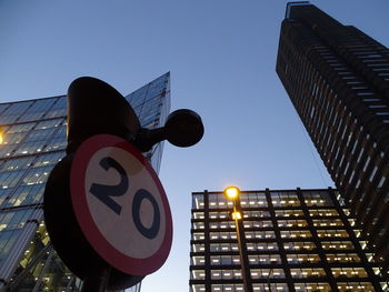 Low angle view of road sign against sky
