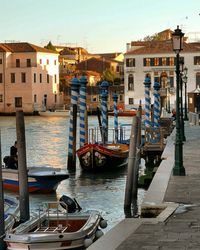 Boats moored in canal