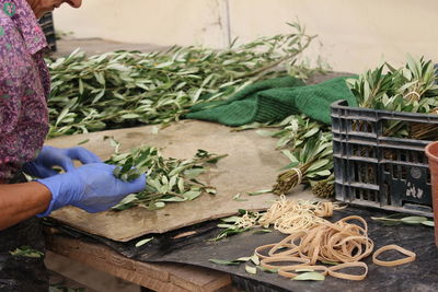 Midsection of woman working in basket