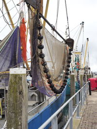 Fishing nets hanging on boat at harbor