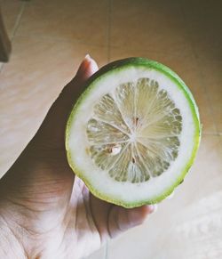 Close-up of hand holding fruit