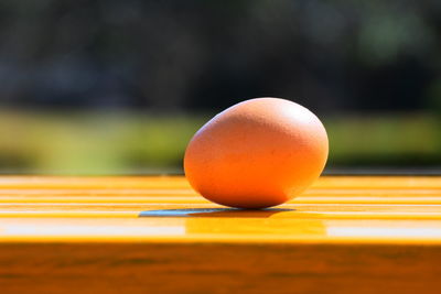 Close-up of orange ball on table