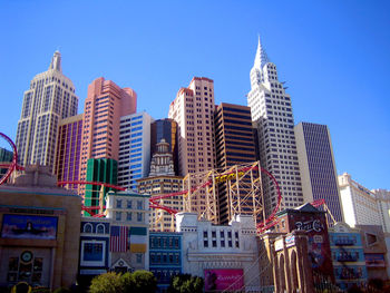 Low angle view of buildings against blue sky