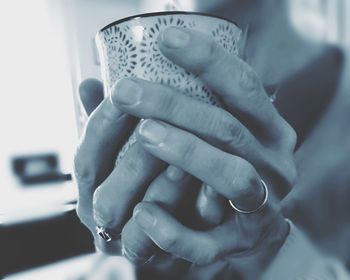 Close-up of man holding hands