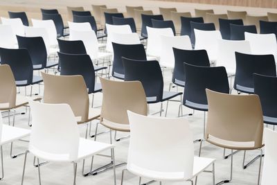 Empty chairs and table in room