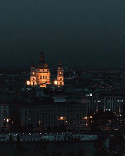 Illuminated church in city at night