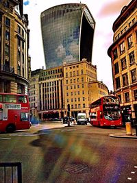 Buildings in city against sky