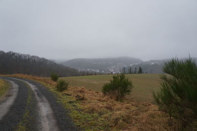 Country road leading towards mountains