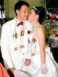 Smiling couple during wedding ceremony