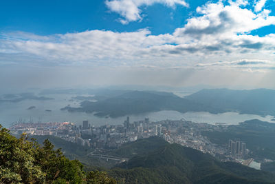High angle view of buildings in city against sky