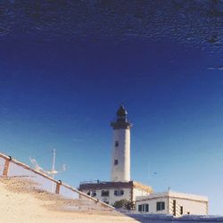 View of lighthouse against blue sky