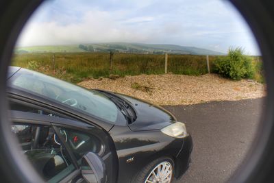 Close-up of car on side-view mirror