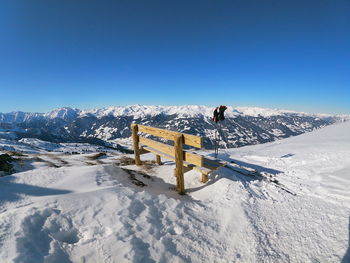 Scenic view of snowcapped mountain against blue sky