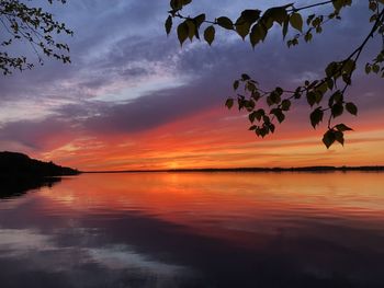 Scenic view of sea against orange sky