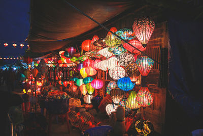 Illuminated lanterns hanging at night