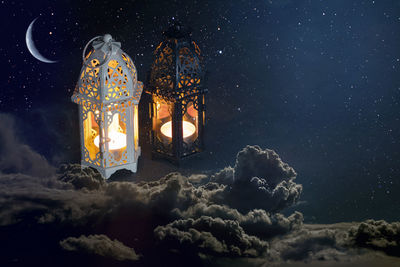 Digital composite image of illuminated lights against sky at night