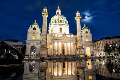 Low angle view of illuminated building against sky