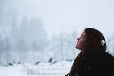 Portrait of young woman in winter