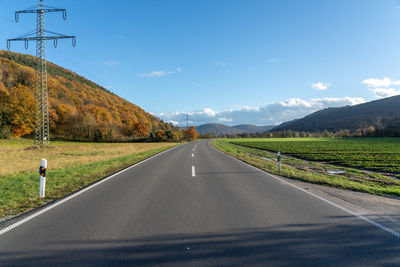 Empty road against sky