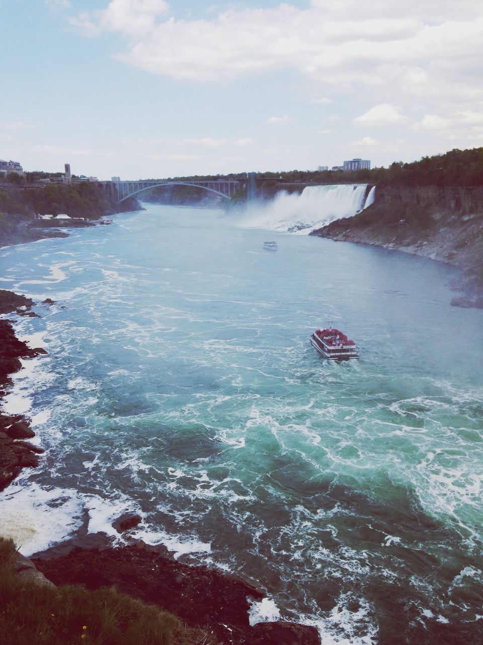 water, scenics, beauty in nature, surf, motion, sea, rock - object, nature, wave, sky, tranquil scene, tranquility, travel, nautical vessel, idyllic, splashing, day, transportation, non-urban scene, tourism