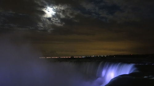 Scenic view of sea against sky at night
