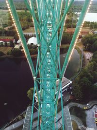 High angle view of rollercoaster at eurowheel by lake