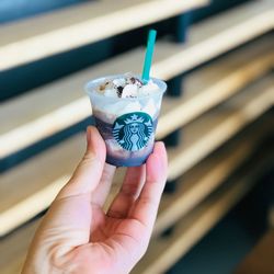 Close-up of hand holding ice cream