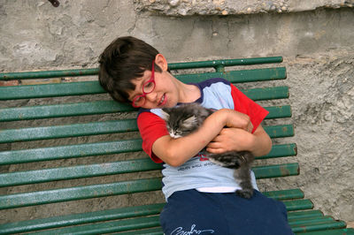 Full length of a smiling woman sitting on staircase