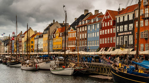 Boats moored at harbor