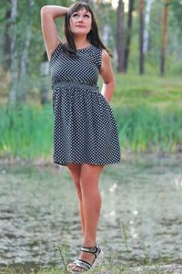 Portrait of beautiful woman standing on land