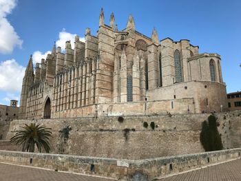 Low angle view of mallorca s cathedral against sky