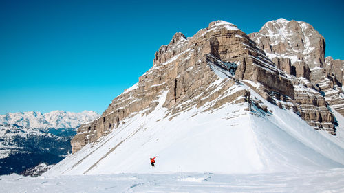 Scenic view of snowcapped mountain against clear sky