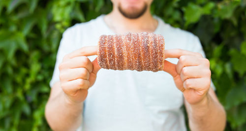 Close-up of man holding ice cream