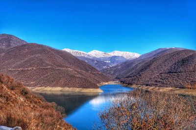 View of lake with mountain range in background