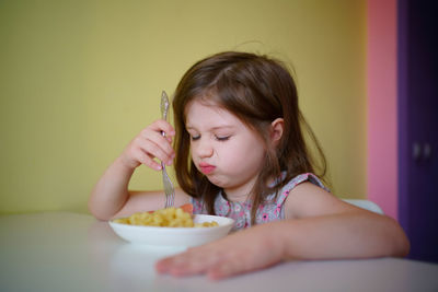 The little girl does not want to eat. selective focus, shallow depth of field