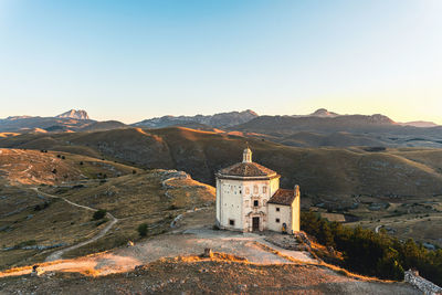 Castle on mountain against sky