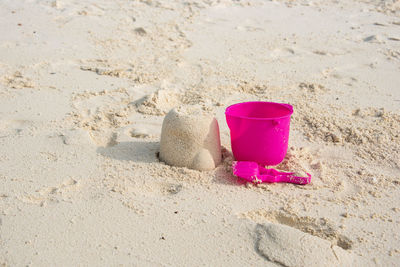 High angle view of pink toy on sand at beach