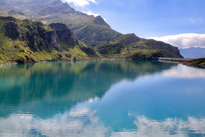 Scenic view of lake against cloudy sky